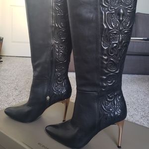 Knee high, pointed toe shoes